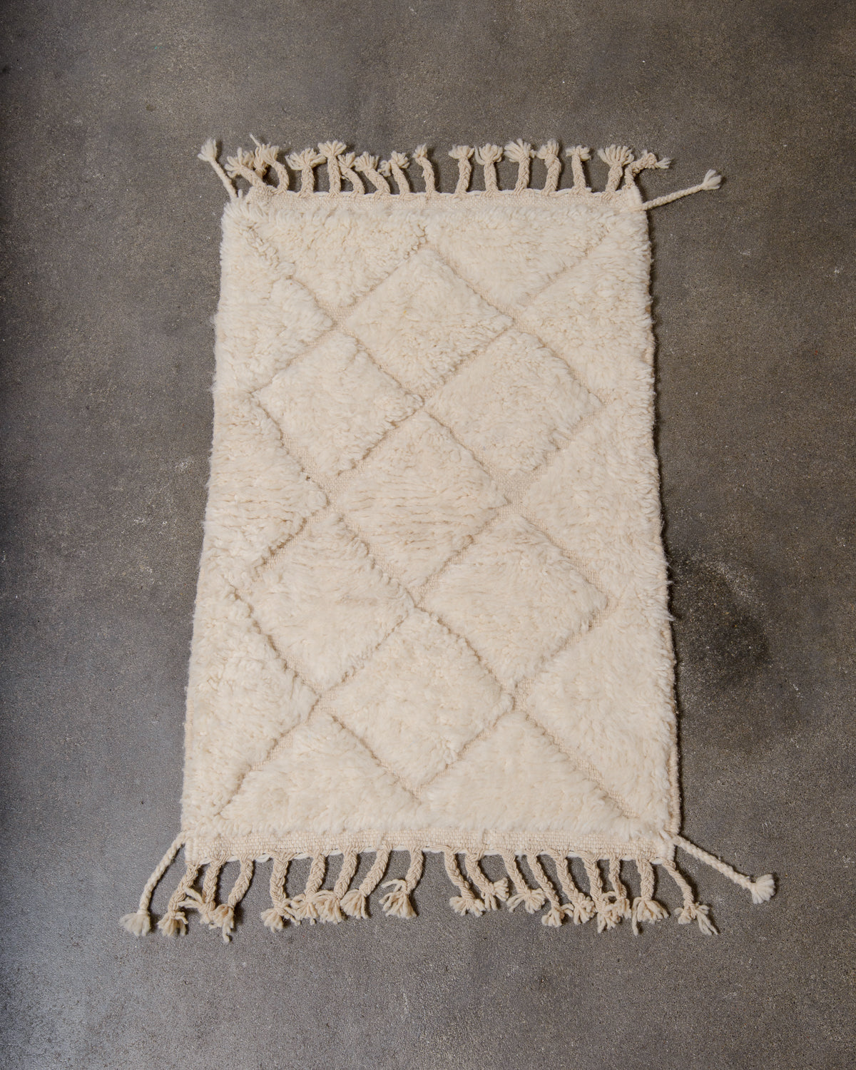 Modern, designer, handcrafted Berber rug from Morocco. Beniourain carpet with minimalist design, natural wool pile and a fluffy texture.